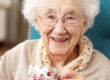 Happy Senior Woman drinking a cup of tea